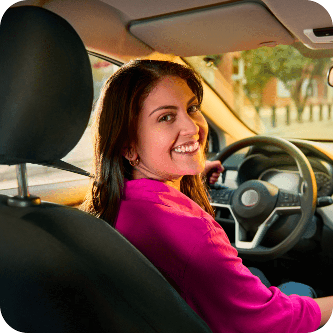 Woman Smiling driving the car