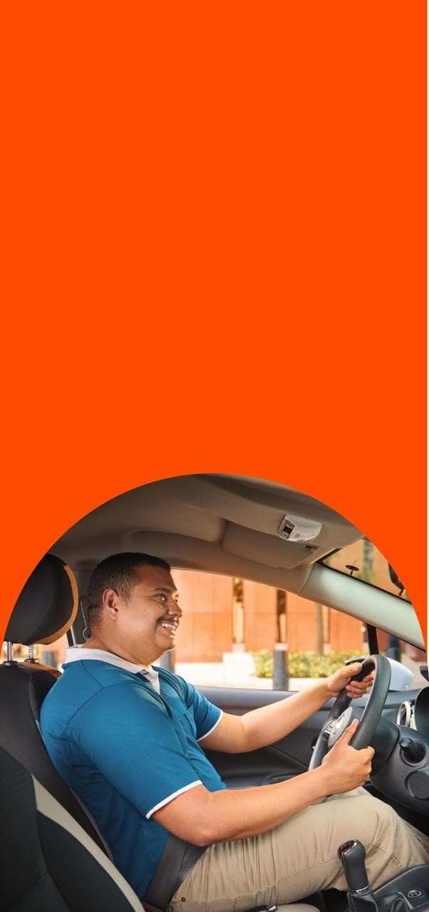 Man Smiling driving the car