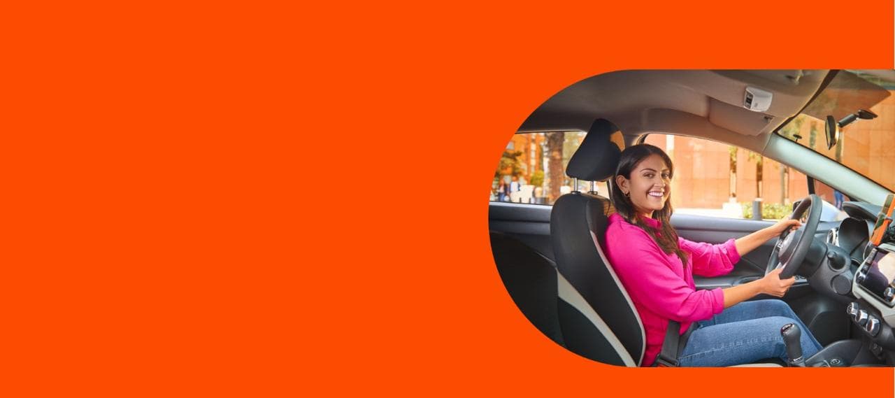 Woman Smiling driving the car