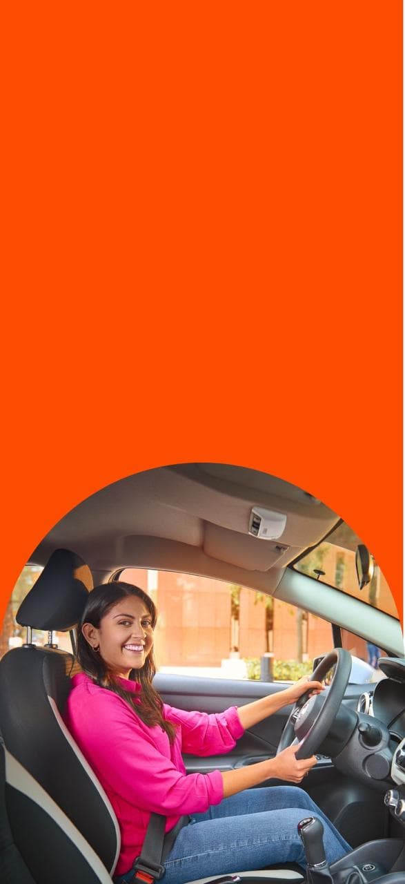 Woman Smiling driving the car