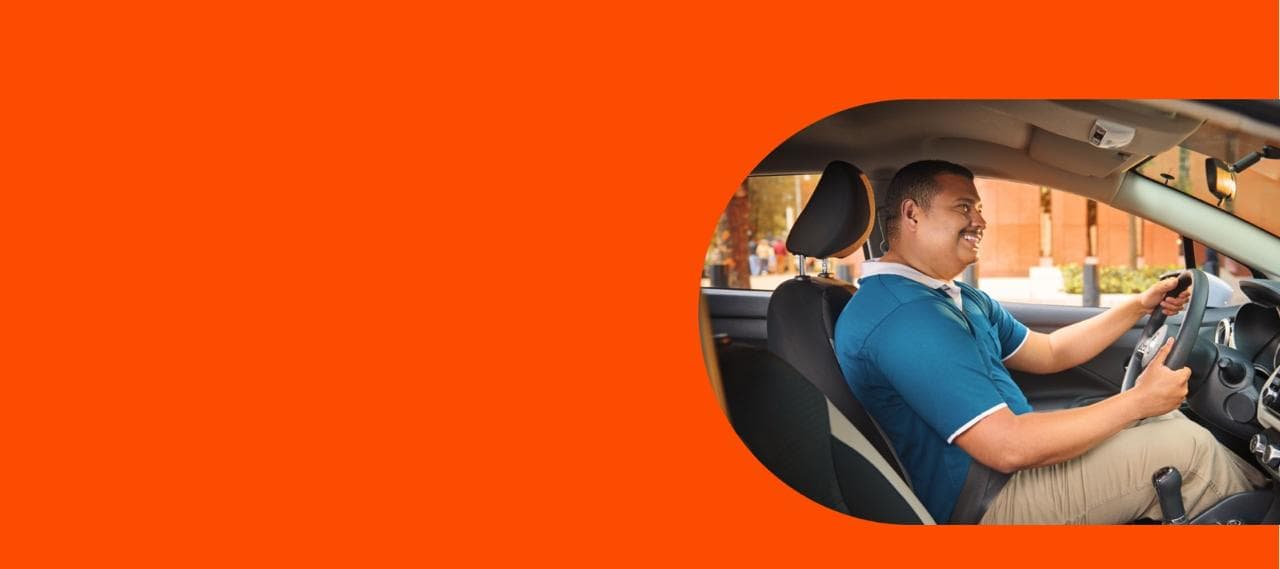 Man Smiling driving the car